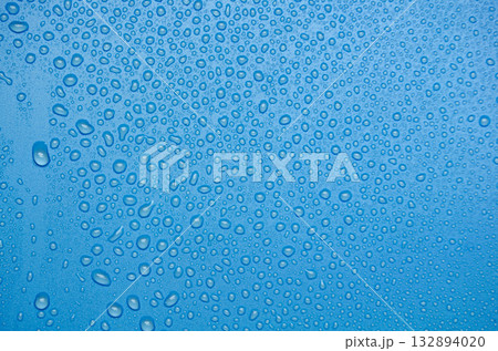Water droplets on ocean blue cover background. Suitable for design and wallpaper. Water droplets on ocean blue cover background. Suitable for design and wallpaper. 132894020