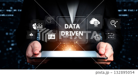 Professional Businessman Holding Digital Tablet Displaying Data Driven Insights and Analytics with Cloud Technology and Visualizations in Modern Environment XDMCP Professional Businessman Holding Digital Tablet Displaying Data Driven Insights and Analytics with Cloud Technology and Visualizations in Modern Environment XDMCP 132895054