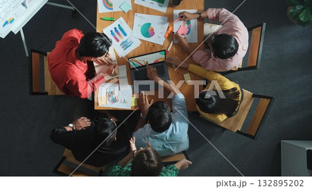 Top view of business team looking at laptop and analyzing chart. Convocation. 132895202
