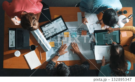 Top down view of manager writing project plan and sitting at meeting. Symposium. Top down view of manager writing project plan and sitting at meeting. Symposium. 132895347