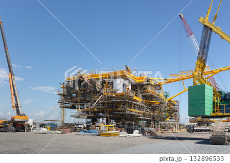 Offshore oil rig under constructionwith sky background. Offshore oil rig under constructionwith sky background. 132896533