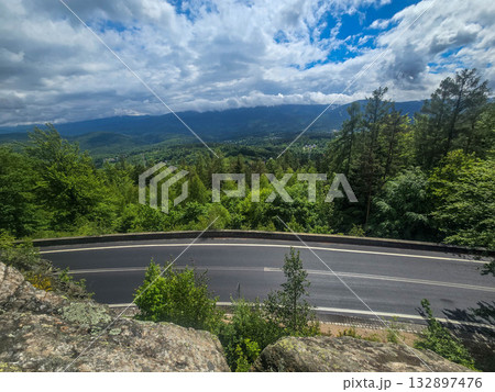 Mountain Horizons Road Through Majestic Peaks 132897476