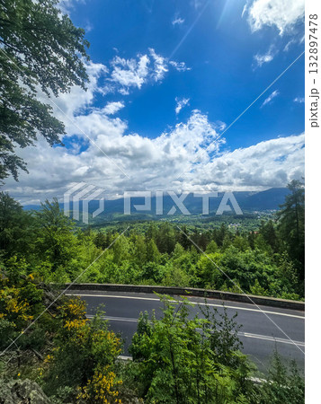 Mountain Horizons Road Through Majestic Peaks 132897478