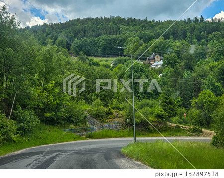 Mountain Horizons Road Through Majestic Peaks 132897518