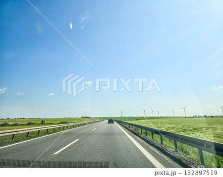 Freedom in Every Step Road Through Fields and Windmills 132897519