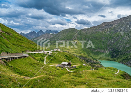 Scenic Alpine Road and Turquoise Lake Landscape in the Austrian Alps, Austria. Scenic Alpine Road and Turquoise Lake Landscape in the Austrian Alps, Austria. 132898348