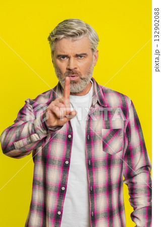 Mature man shaking head, waving finger, expressing no, negative gesture refusal disagreement concept Mature man shaking head, waving finger, expressing no, negative gesture refusal disagreement concept 132902088