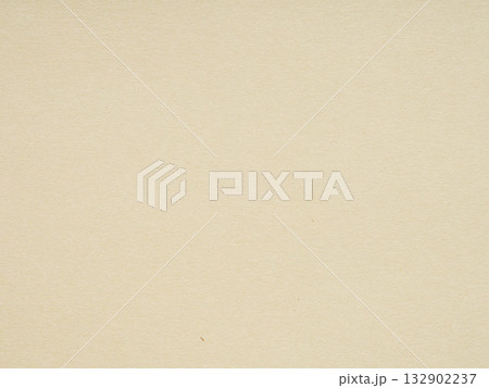 A close-up view reveals the subtle textures and warm beige tones of this paper's surface 132902237