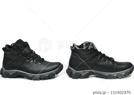 Two winter black leather boot sneaker shoes with laces on white Two winter black leather boot sneaker shoes with laces on white 132902970