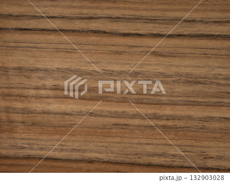 Striated Daniela veneer showcasing natural wood streaks and warm hues Striated Daniela veneer showcasing natural wood streaks and warm hues 132903028