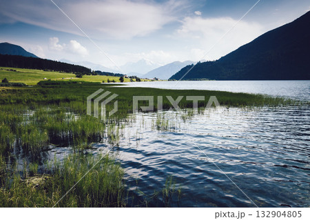 Great of the alpine Haidersee lake. Location San Valentino Alla Muta village, Italy alps, Europe. 132904805