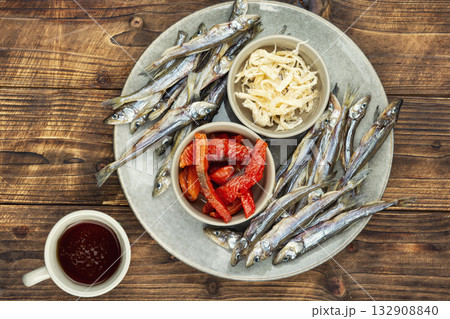 Beer and assorted dried fish 132908840