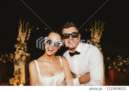 Joyful Wedding Celebration with Playful Sunglasses 132909620