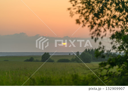 A Serene Sunrise Unfolds Over a Beautifully Tranquil Landscape, Filled with Natures Beauty 132909907