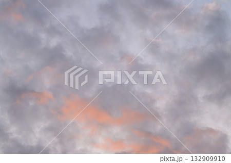 A Beautiful Sunset Sky Adorned with Soft and Fluffy Clouds Filling the Evening Horizon A Beautiful Sunset Sky Adorned with Soft and Fluffy Clouds Filling the Evening Horizon 132909910