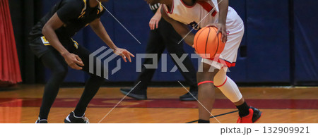 Intense Basketball Game Moment With Two Players in Action on Court Intense Basketball Game Moment With Two Players in Action on Court 132909921