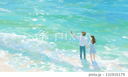 青い海の波打ち際で自撮りをするカップル 132910179