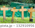 nameless wooden crosses on a meadow 132910956