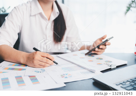 Business woman analyze calculate company financial, tax results office accounting statistics analytical research. calculating business balance prepare tax reduction. Tax deduction planning concept. Business woman analyze calculate company financial, tax results office accounting statistics analytical research. calculating business balance prepare tax reduction. Tax deduction planning concept. 132911043