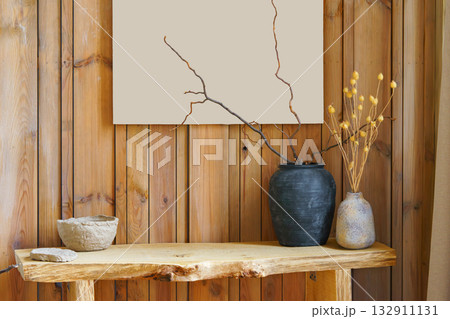 Minimal natural decor, ceramic vases and dry branches on  rustic wooden wall background 132911131