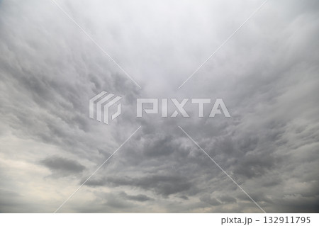The scene depicts a dramatic, cloudy sky that creates an overcast and moody atmosphere The scene depicts a dramatic, cloudy sky that creates an overcast and moody atmosphere 132911795