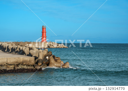 Red Lighthouse and Tetrapods at Naksan Beach Breakwater, South Korea Red Lighthouse and Tetrapods at Naksan Beach Breakwater, South Korea 132914770