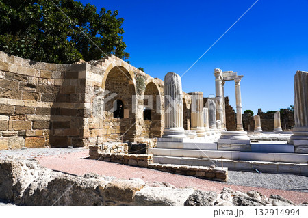 Exploring Ancient Architecture: A Journey Through Historical Ruins with Towering Columns and Arched Structures Under a Clear Blue Sky Exploring Ancient Architecture: A Journey Through Historical Ruins with Towering Columns and Arched Structures Under a Clear Blue Sky 132914994