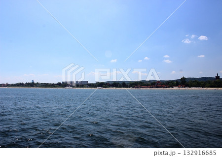 Sopot beach and city skyline viewed from the sea on sunny day 132916685
