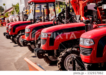Rows of modern tractors. Industrial details. Agricultural Rows of modern tractors. Industrial details. Agricultural 132917062