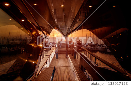 View of harbor with yachts details. Beautiful sunset sky in the marina bay. 132917138