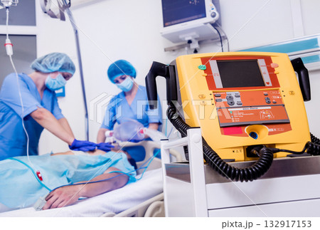 Doctors give resuscitation to a male patient in the emergency room. Doctors give resuscitation to a male patient in the emergency room. 132917153