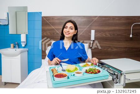 Tray with breakfast for the young female patient. Tray with breakfast for the young female patient. 132917245