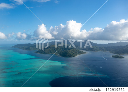 Aerial view of Tahaa island, French Polynesia, with turquoise lagoon and reef Aerial view of Tahaa island, French Polynesia, with turquoise lagoon and reef 132919251
