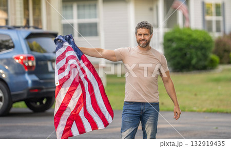 National flag. Independence day. American Flag for Independence Day or 4th of July. Man hold American flag outdoor. Patriotic man with patriotic symbol. American independence. Day of liberty National flag. Independence day. American Flag for Independence Day or 4th of July. Man hold American flag outdoor. Patriotic man with patriotic symbol. American independence. Day of liberty 132919435