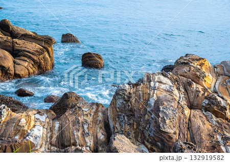 Waves splashing on unique rock formations at Waimushan coastline, Taiwan. Waves splashing on unique rock formations at Waimushan coastline, Taiwan. 132919582