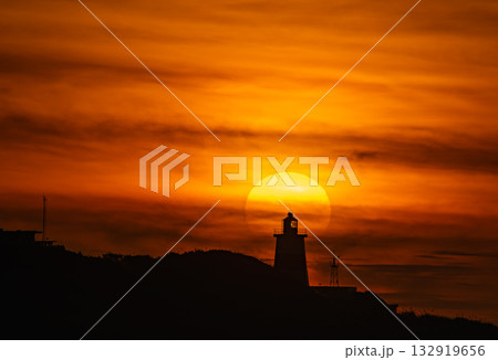 Sunset behind Fuguei Cape Lighthouse in Shimen New Taipei City Taiwan. Sunset behind Fuguei Cape Lighthouse in Shimen New Taipei City Taiwan. 132919656