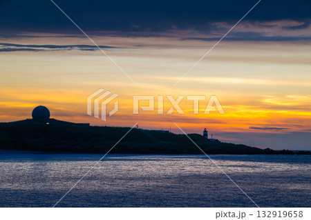 Dreamy Sunset Over Shimen Taiwan with Lighthouse and Moving Clouds. Dreamy Sunset Over Shimen Taiwan with Lighthouse and Moving Clouds. 132919658