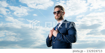 handsome ceo in suit on sky background. ceo in suit outdoor. ceo in business suit. handsome ceo in suit on sky background. ceo in suit outdoor. ceo in business suit. 132919713