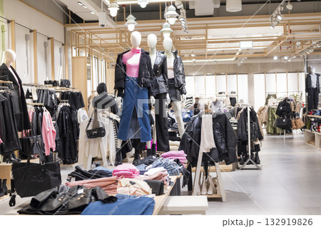 mannequins on display in a store with clothes in a shopping center 132919826