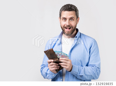 man pay money in studio, copy space. man pay money banknotes. photo of man pay money. man pay money in studio, copy space. man pay money banknotes. photo of man pay money. 132919835