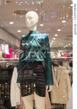 mannequins on display in a store with clothes in a shopping center mannequins on display in a store with clothes in a shopping center 132919846