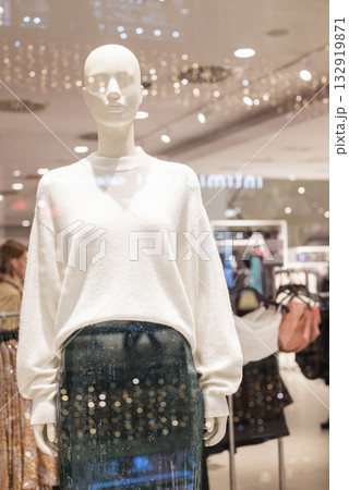 mannequins on display in a store with clothes in a shopping center 132919871
