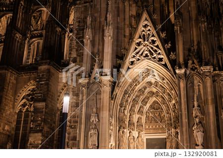 night scene, details of the facade of the Gothic cathedral in the city center, Cologne Dome Church at Germany City. night scene, details of the facade of the Gothic cathedral in the city center, Cologne Dome Church at Germany City. 132920081
