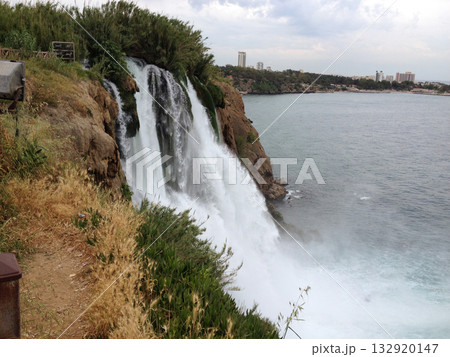 Duden Waterfall crashes down rocky cliff near city in Turkey in the province of Antalya . Force, motion, gravity, solitude, erosion, time, connection, awe, freedom, and escape from urban routine Duden Waterfall crashes down rocky cliff near city in Turkey in the province of Antalya . Force, motion, gravity, solitude, erosion, time, connection, awe, freedom, and escape from urban routine 132920147