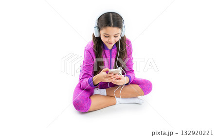 smiling teen girl use music app in studio. teen girl use music app on background. smiling teen girl use music app in studio. teen girl use music app on background. 132920221