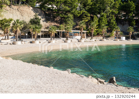 a beautiful beach with a view of the Adriatic Sea with rocks on the shore and pine trees in Split, Croatia a beautiful beach with a view of the Adriatic Sea with rocks on the shore and pine trees in Split, Croatia 132920244