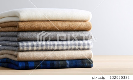 Stack of Folded Wool Sweaters in Neutral Tones Stack of Folded Wool Sweaters in Neutral Tones 132920382