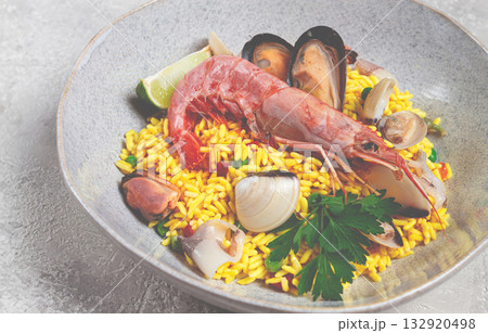 seafood paella, on a plate, traditional Spanish dish, top view, no people, 132920498