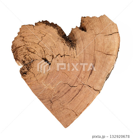 Heart-shaped wooden piece with natural texture and grain details on white 132920678