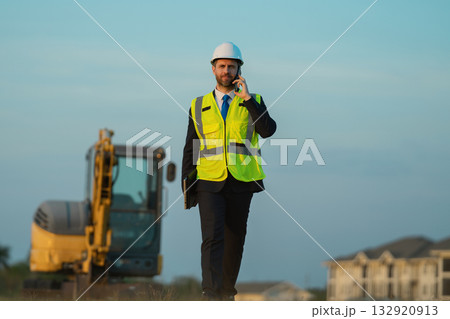 construction business owner in helmet at building site outdoor 132920913